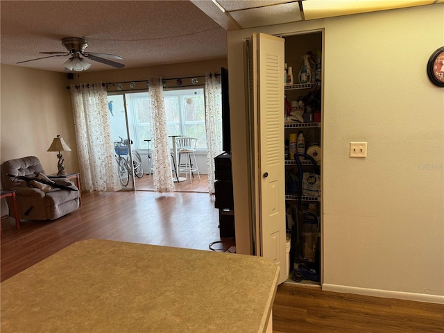 21260 Brinson Ave Unit 110, Port Charlotte, FL 33952 - living area featuring dark wood-style floors and a ceiling fan
