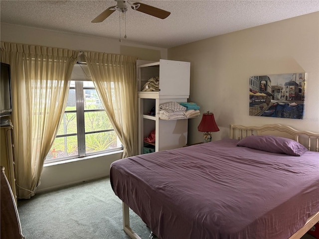 21260 Brinson Ave Unit 110, Port Charlotte, FL 33952 - carpeted bedroom with a textured ceiling and a ceiling fan
