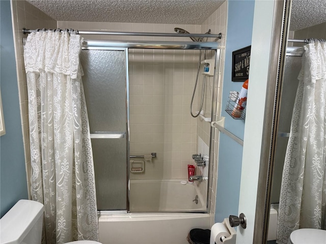 21260 Brinson Ave Unit 110, Port Charlotte, FL 33952 - bathroom featuring bath / shower combo with glass door and a textured ceiling