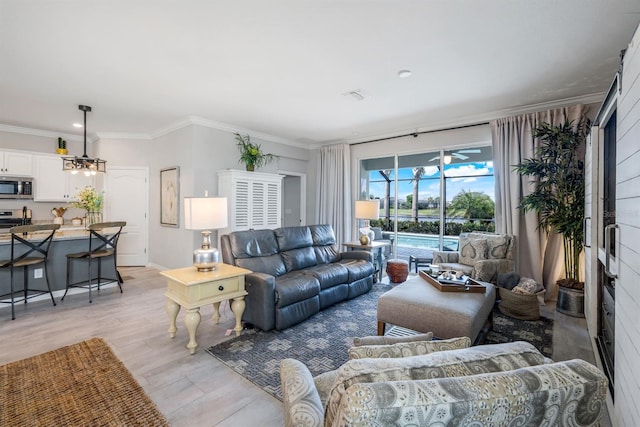43249 Treadway Dr, Punta Gorda, FL 33982 - living area featuring light wood-type flooring and ornamental molding