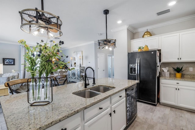 43249 Treadway Dr, Punta Gorda, FL 33982 - kitchen with a sink, fridge with ice dispenser, a chandelier, dishwashing machine, and white cabinetry