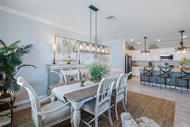 43249 Treadway Dr, Punta Gorda, FL 33982 - dining space featuring ornamental molding, recessed lighting, light wood-style flooring, and baseboards