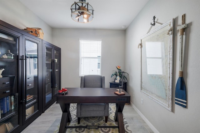 43249 Treadway Dr, Punta Gorda, FL 33982 - home office featuring a chandelier and baseboards