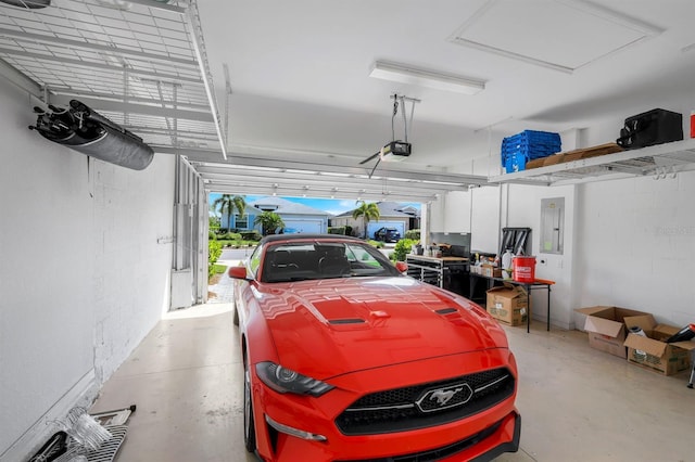 43249 Treadway Dr, Punta Gorda, FL 33982 - garage featuring a garage door opener and electric panel