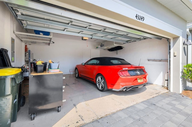 43249 Treadway Dr, Punta Gorda, FL 33982 - garage with a garage door opener and electric panel
