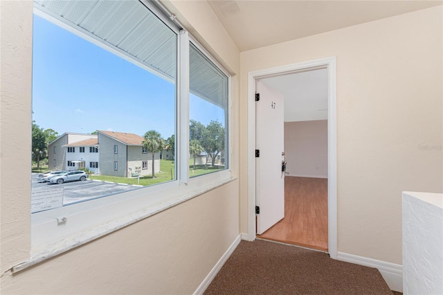 22481 Westchester Blvd Unit B47, Punta Gorda, FL 33980 - corridor with baseboards and carpet