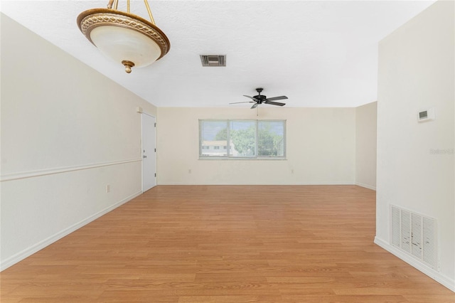 22481 Westchester Blvd Unit B47, Punta Gorda, FL 33980 - empty room featuring light wood-style floors, ceiling fan, and baseboards