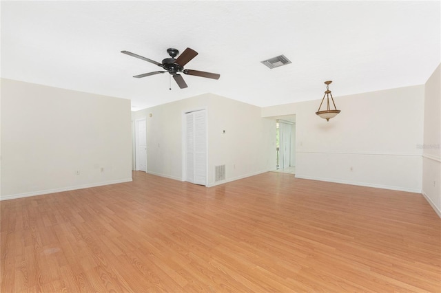 22481 Westchester Blvd Unit B47, Punta Gorda, FL 33980 - unfurnished living room featuring ceiling fan, light wood finished floors, and baseboards