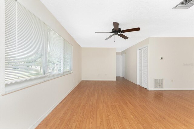 22481 Westchester Blvd Unit B47, Punta Gorda, FL 33980 - empty room featuring light wood-type flooring, ceiling fan, and baseboards