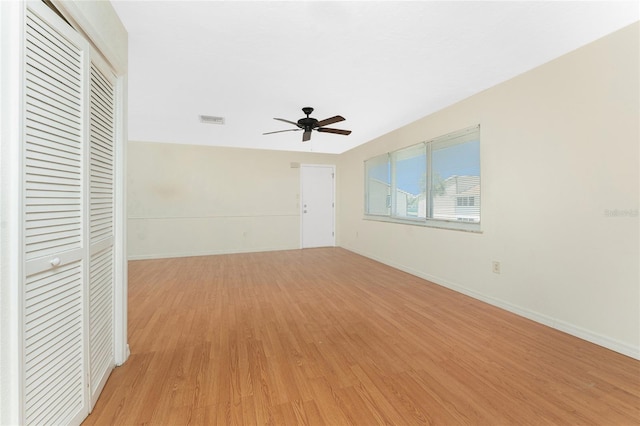 22481 Westchester Blvd Unit B47, Punta Gorda, FL 33980 - unfurnished living room with light wood-style floors, a ceiling fan, and baseboards
