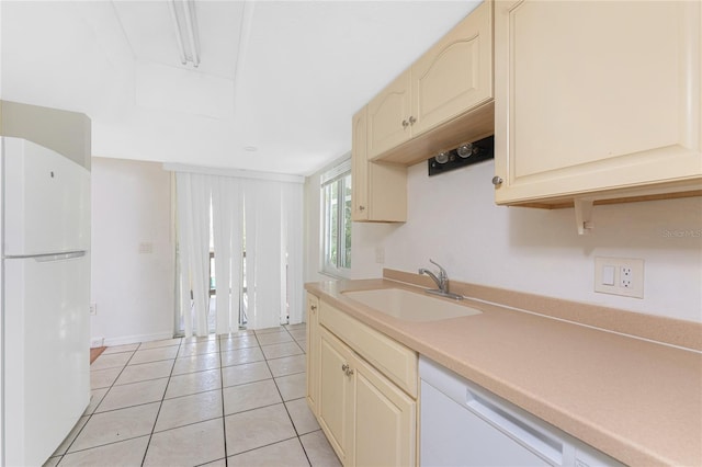 22481 Westchester Blvd Unit B47, Punta Gorda, FL 33980 - kitchen with white appliances, a sink, light countertops, light tile patterned floors, and cream cabinetry
