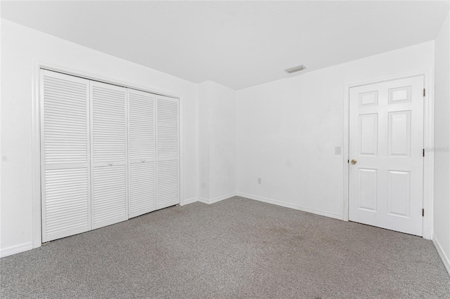 22481 Westchester Blvd Unit B47, Punta Gorda, FL 33980 - unfurnished bedroom with carpet flooring, a closet, and baseboards