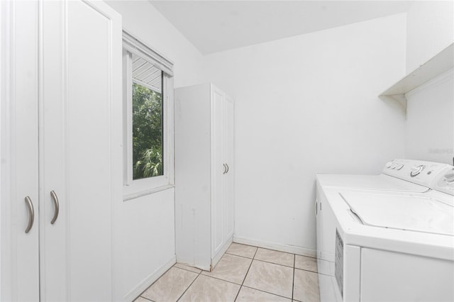 22481 Westchester Blvd Unit B47, Punta Gorda, FL 33980 - laundry room with washer and dryer and light tile patterned flooring