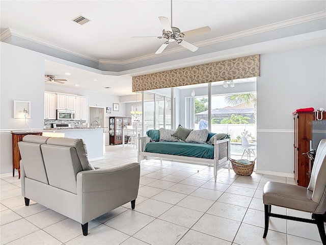 1007 Comstock St, Port Charlotte, FL 33952 - living area with a ceiling fan, light tile patterned flooring, ornamental molding, baseboards, and recessed lighting