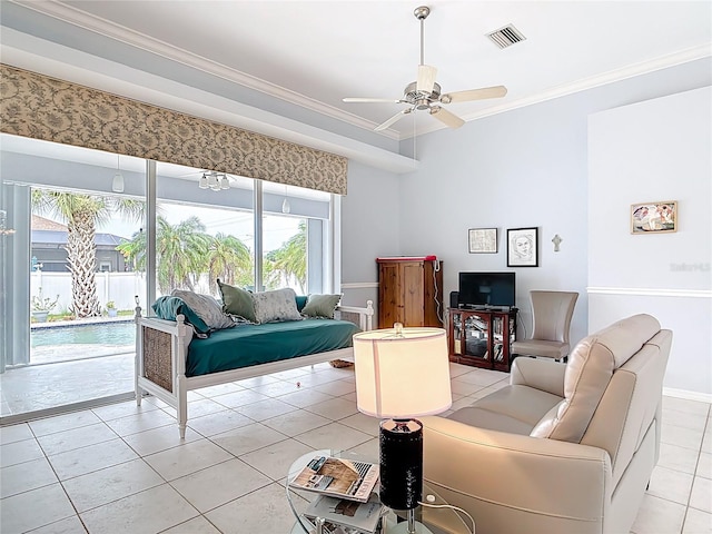 1007 Comstock St, Port Charlotte, FL 33952 - living room with light tile patterned floors, crown molding, ceiling fan, and baseboards