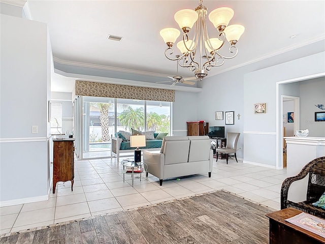 1007 Comstock St, Port Charlotte, FL 33952 - living room with ornamental molding, light tile patterned flooring, a chandelier, baseboards, and a ceiling fan