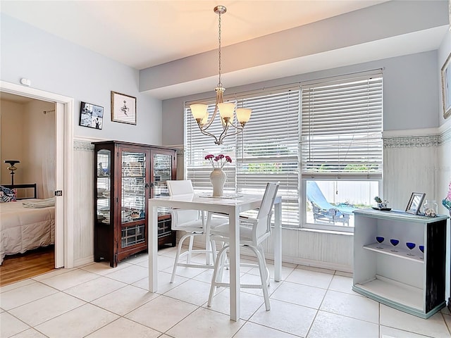 1007 Comstock St, Port Charlotte, FL 33952 - dining space with a chandelier and light tile patterned flooring