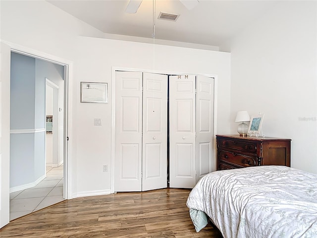 1007 Comstock St, Port Charlotte, FL 33952 - bedroom featuring a closet, wood finished floors, ceiling fan, and baseboards