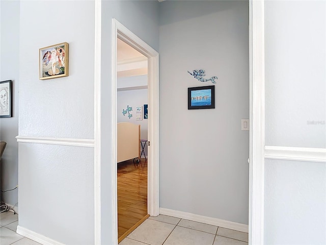 1007 Comstock St, Port Charlotte, FL 33952 - hallway with light tile patterned floors and baseboards
