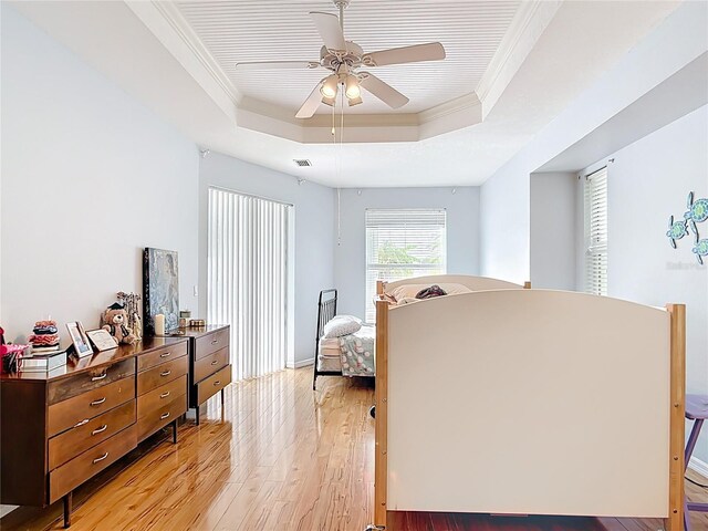 1007 Comstock St, Port Charlotte, FL 33952 - bedroom featuring a raised ceiling, light wood-style flooring, ornamental molding, and ceiling fan