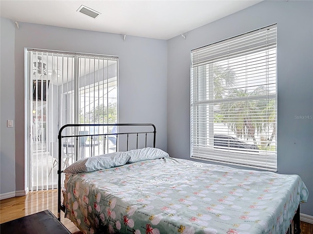 1007 Comstock St, Port Charlotte, FL 33952 - bedroom with wood finished floors and baseboards