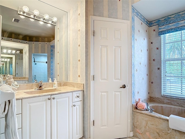 1007 Comstock St, Port Charlotte, FL 33952 - full bath featuring wallpapered walls, a bath, and vanity