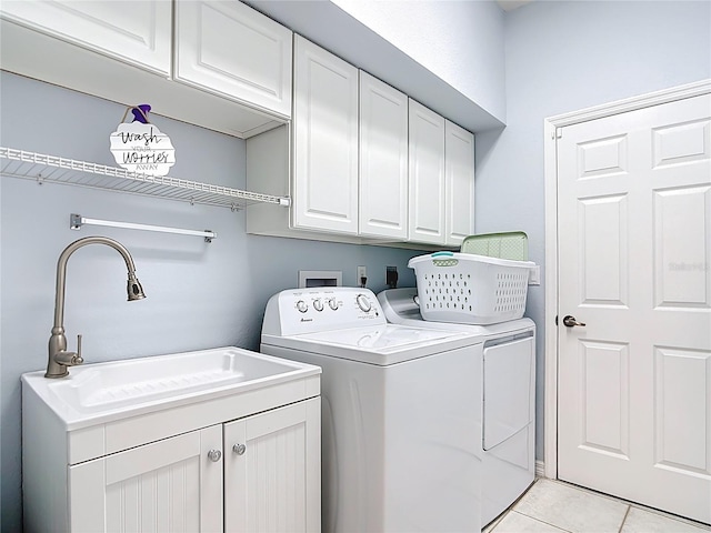 1007 Comstock St, Port Charlotte, FL 33952 - laundry area featuring cabinet space, independent washer and dryer, and light tile patterned floors
