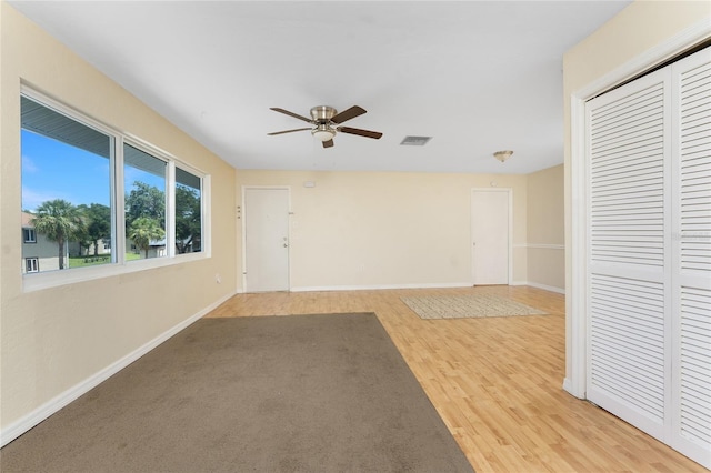 22481 Westchester Blvd Unit B48, Punta Gorda, FL 33980 - empty room with a ceiling fan, baseboards, and light wood-type flooring