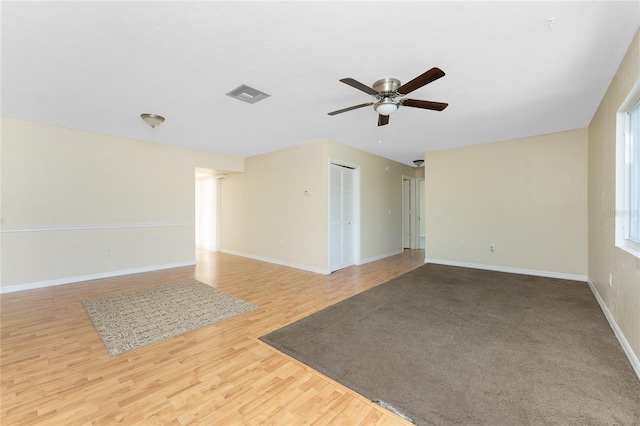 22481 Westchester Blvd Unit B48, Punta Gorda, FL 33980 - empty room with ceiling fan, wood finished floors, and baseboards