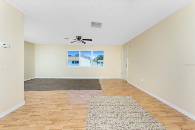 22481 Westchester Blvd Unit B48, Punta Gorda, FL 33980 - spare room with wood finished floors, a ceiling fan, and baseboards