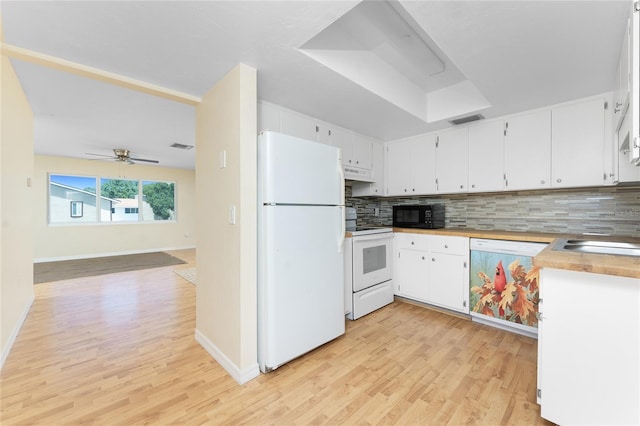 22481 Westchester Blvd Unit B48, Punta Gorda, FL 33980 - kitchen featuring white appliances, light wood-style flooring, decorative backsplash, and under cabinet range hood