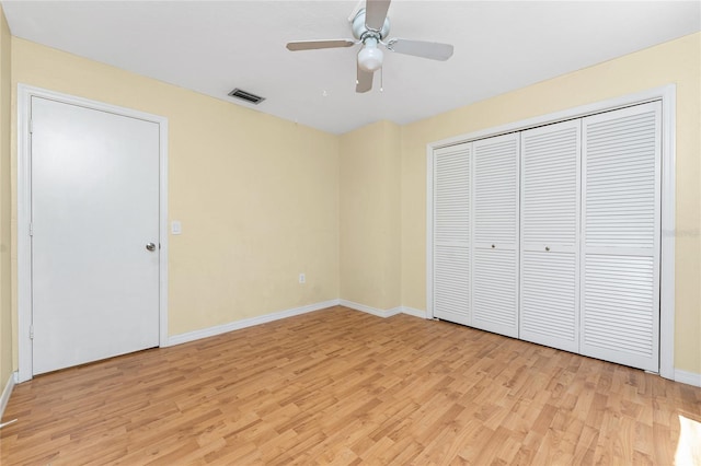 22481 Westchester Blvd Unit B48, Punta Gorda, FL 33980 - unfurnished bedroom with light wood-style floors, baseboards, a ceiling fan, and a closet