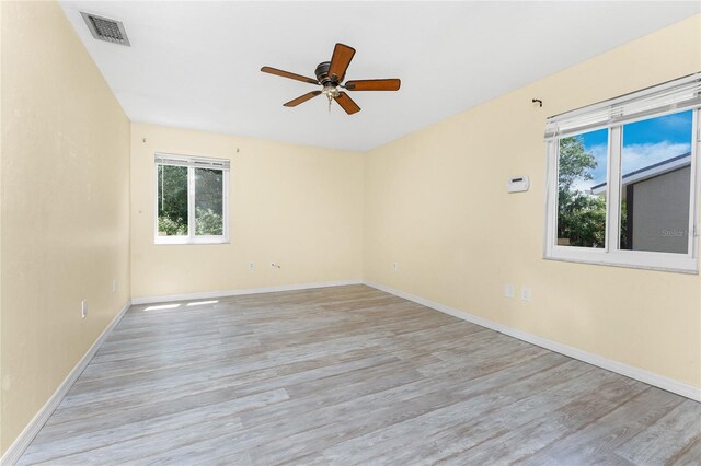22481 Westchester Blvd Unit B48, Punta Gorda, FL 33980 - unfurnished room featuring healthy amount of natural light, ceiling fan, light wood finished floors, and baseboards