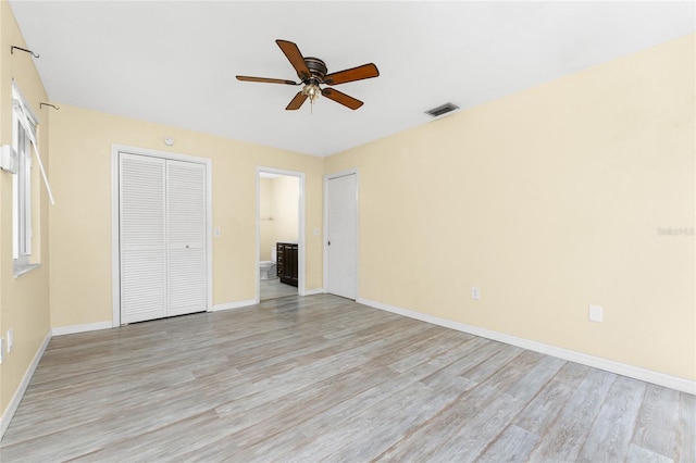 22481 Westchester Blvd Unit B48, Punta Gorda, FL 33980 - unfurnished bedroom featuring light wood finished floors, baseboards, and ensuite bath