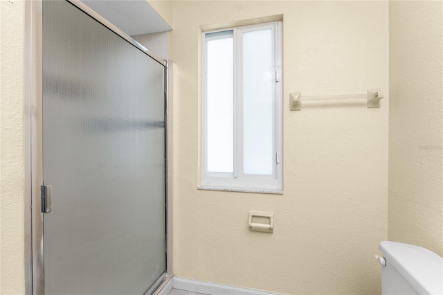 22481 Westchester Blvd Unit B48, Punta Gorda, FL 33980 - full bathroom featuring toilet, a shower stall, plenty of natural light, and baseboards