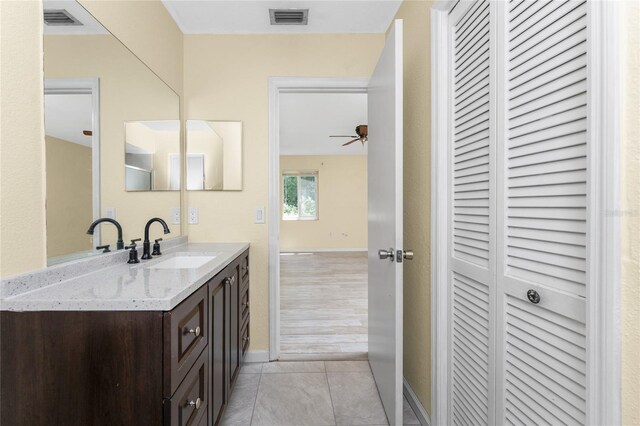 22481 Westchester Blvd Unit B48, Punta Gorda, FL 33980 - bathroom with a closet, vanity, ceiling fan, tile patterned flooring, and baseboards