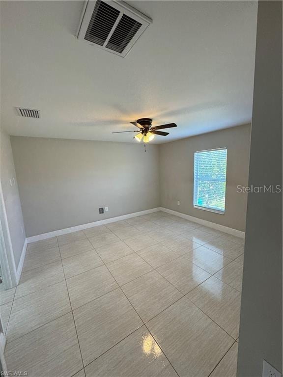 4916/4918 24th St SW, Lehigh Acres, FL 33973 - empty room with baseboards, light tile patterned floors, and a ceiling fan