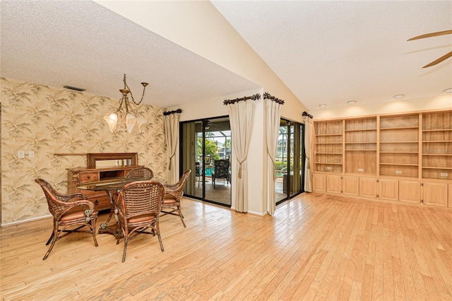 2160 Aqui Esta Dr, Punta Gorda, FL 33950 - dining area with wallpapered walls, light wood-type flooring, baseboards, ceiling fan, and a textured ceiling