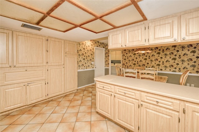 2160 Aqui Esta Dr, Punta Gorda, FL 33950 - kitchen with wallpapered walls, wainscoting, light tile patterned floors, and light countertops