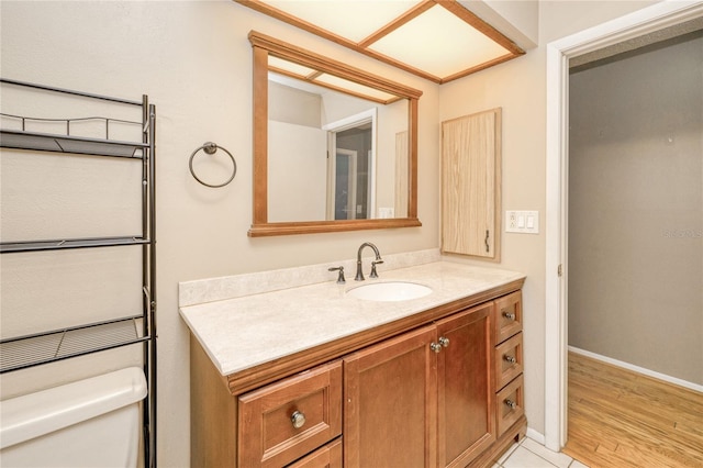 2160 Aqui Esta Dr, Punta Gorda, FL 33950 - bathroom with toilet, vanity, and baseboards