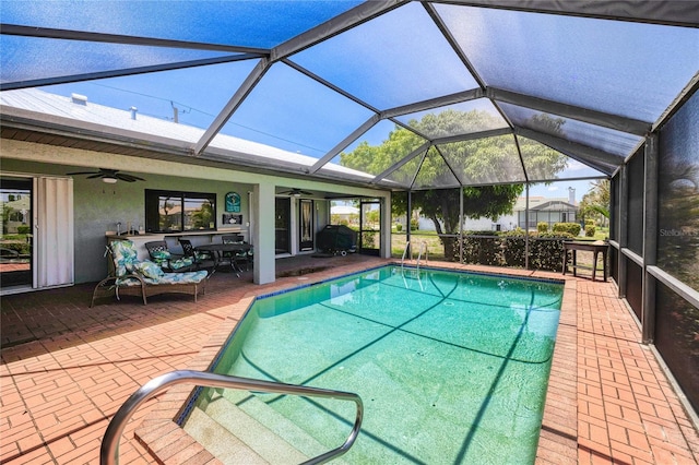 2160 Aqui Esta Dr, Punta Gorda, FL 33950 - outdoor pool featuring a ceiling fan, a patio, and glass enclosure