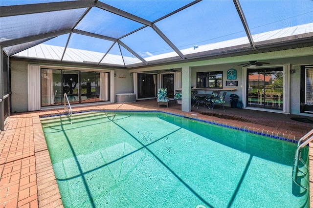 2160 Aqui Esta Dr, Punta Gorda, FL 33950 - swimming pool featuring a ceiling fan, a patio area, and glass enclosure
