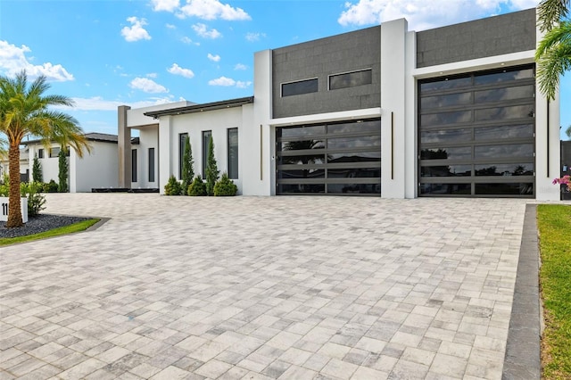 1108 SW 24th St, Cape Coral, FL 33991 - contemporary home featuring decorative driveway and stucco siding