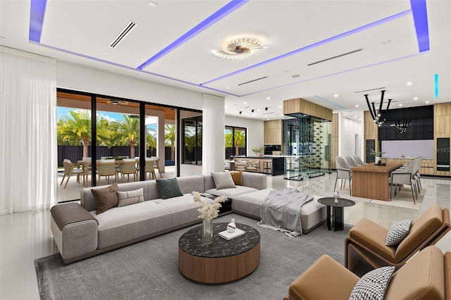 1108 SW 24th St, Cape Coral, FL 33991 - living room featuring a chandelier and recessed lighting