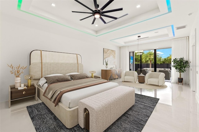 1108 SW 24th St, Cape Coral, FL 33991 - bedroom featuring a tray ceiling, access to exterior, tile patterned flooring, and recessed lighting