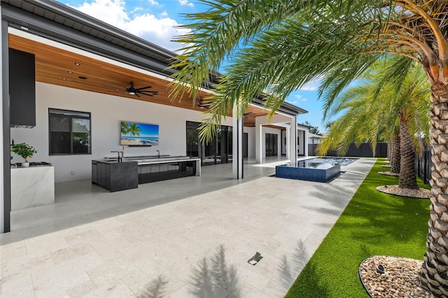 1108 SW 24th St, Cape Coral, FL 33991 - view of patio with exterior kitchen, ceiling fan, and a sink