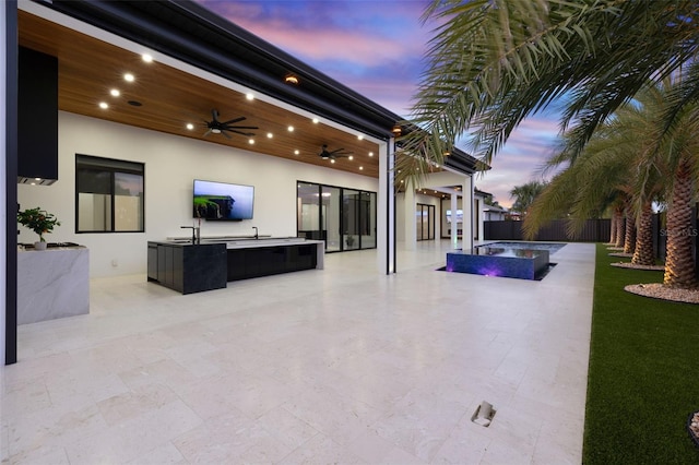 1108 SW 24th St, Cape Coral, FL 33991 - fenced backyard with exterior kitchen, ceiling fan, a patio, and a pool with connected hot tub