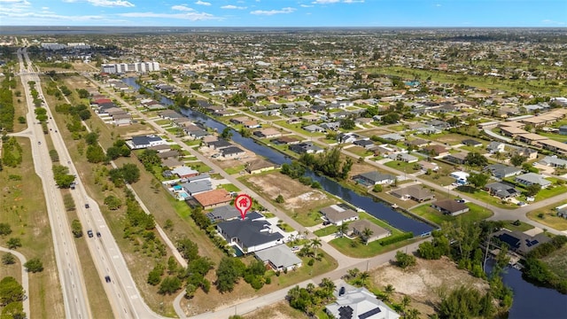 1108 SW 24th St, Cape Coral, FL 33991 - aerial view of property and surrounding area with a nearby body of water and nearby suburban area