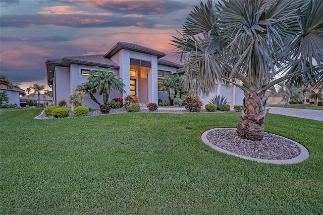 1801 Los Alamos Dr, Punta Gorda, FL 33950 - view of front of house featuring a yard and stucco siding