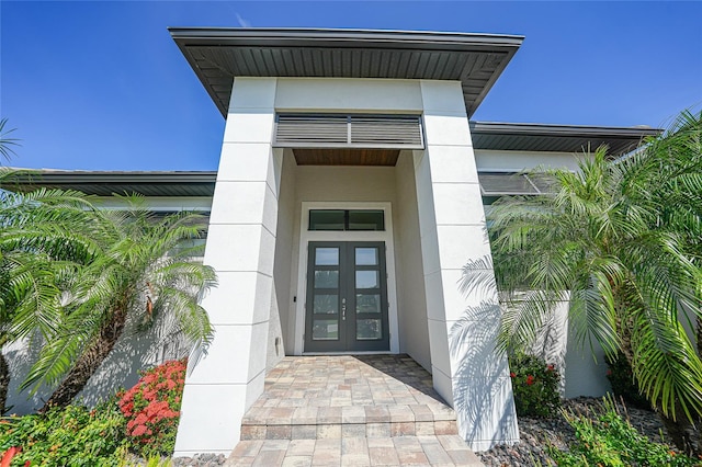 1801 Los Alamos Dr, Punta Gorda, FL 33950 - entrance to property with french doors and stucco siding